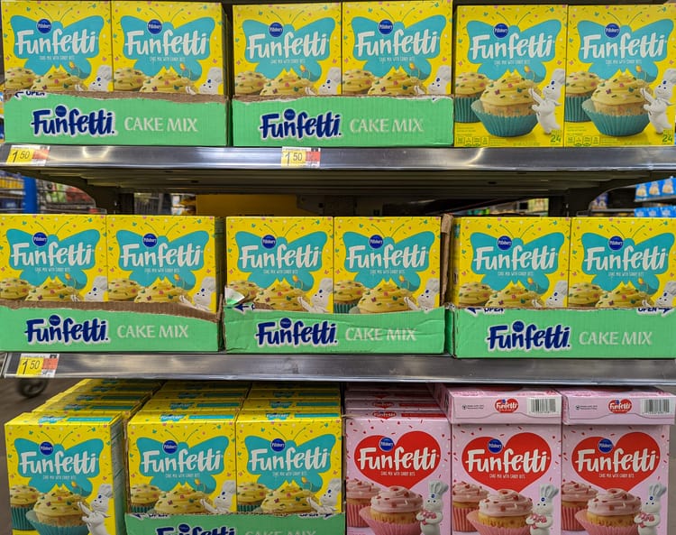 Store shelf with many boxes of colorful cake mix branded "Funfetti." We could all use more fun in our lives