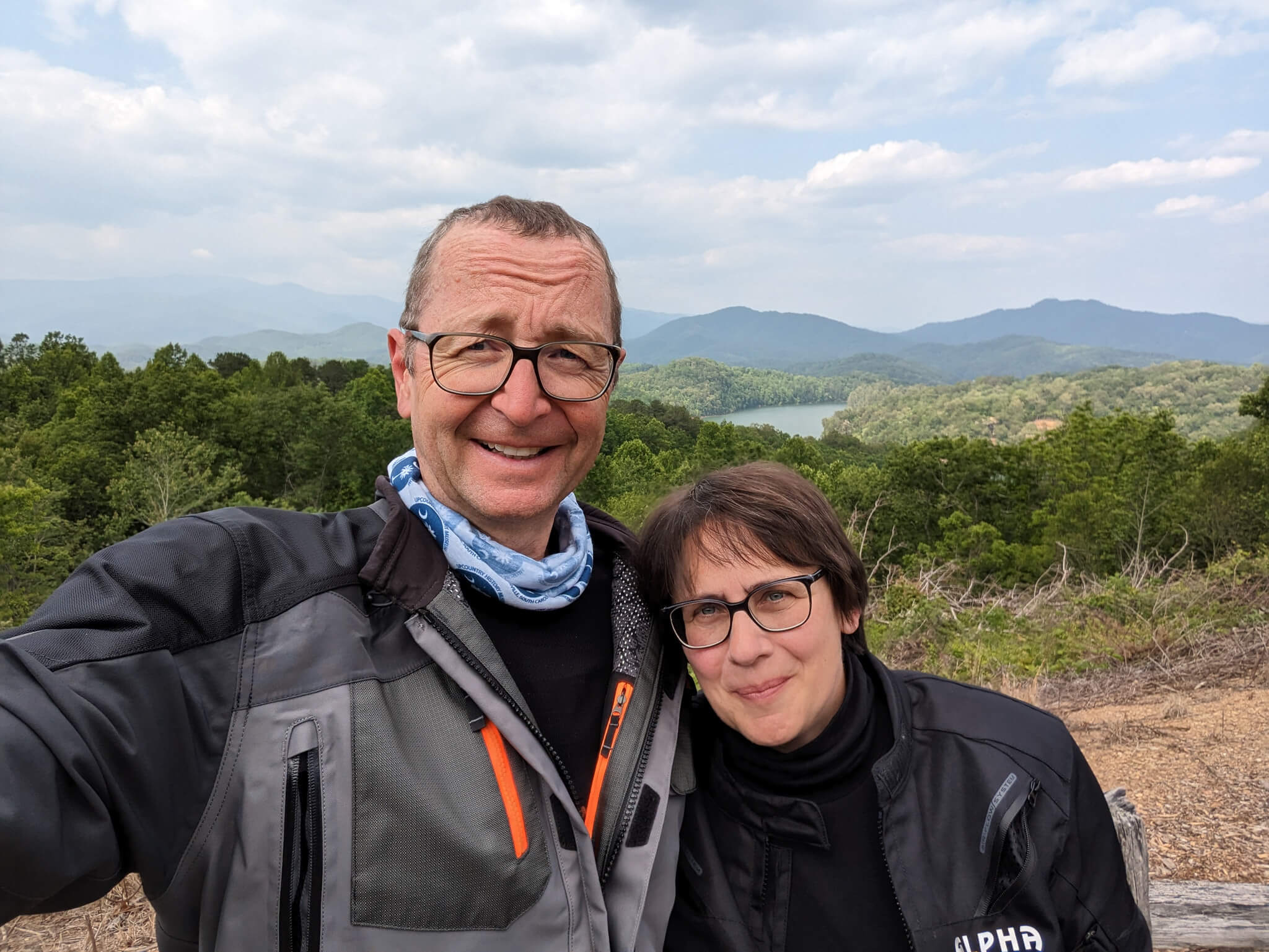 Two riders with Smoky Mountains in background