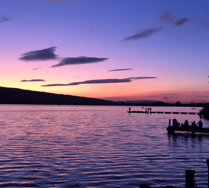 Purple colored sky in the aftermath of a sunset over a large lake