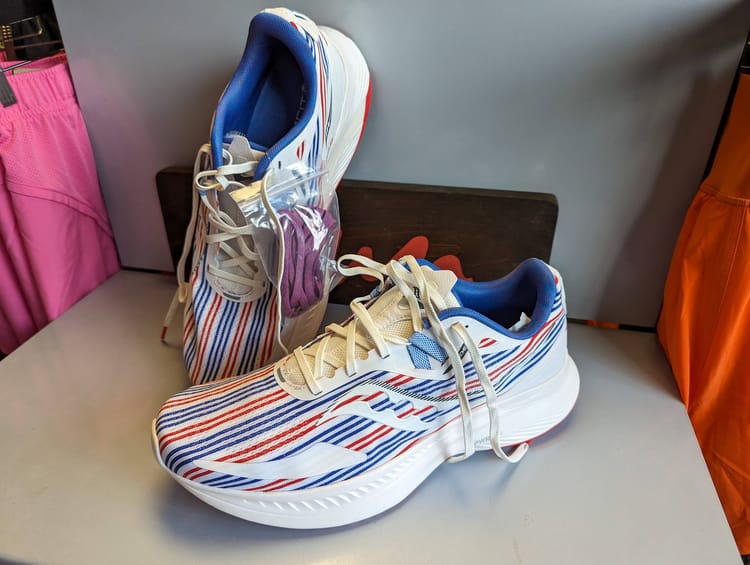 A pair of red, white, and blue running shoes