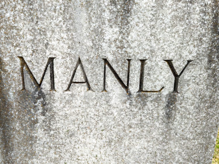 Gravestone bearing the word "MANLY". Don't read anything into the fact that this is a gravestone