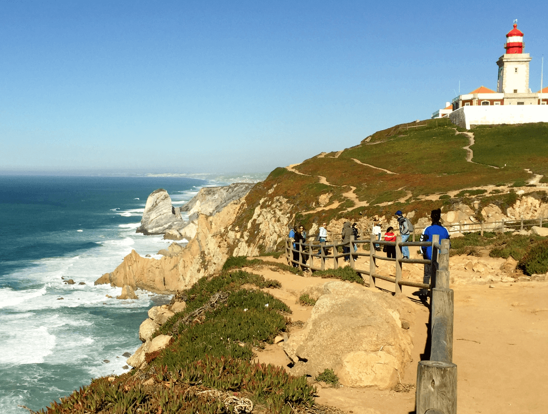 Coastal cliffside with lighthouse in background - Moral Letters to Lucilius