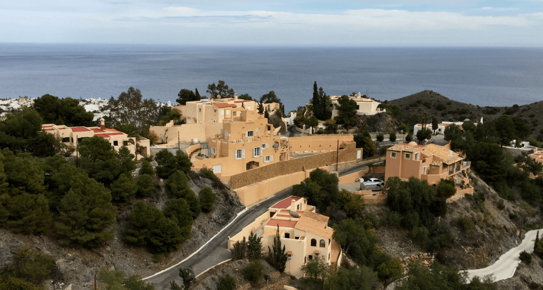 Pastel houses with ocean in background - Moral Letters to Lucilius