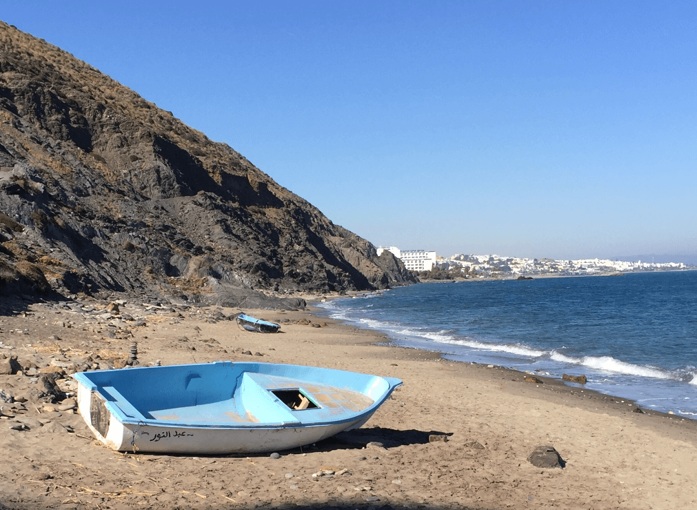 Abandoned blue dinghy on beach by the ocean - Moral Letters to Lucilius