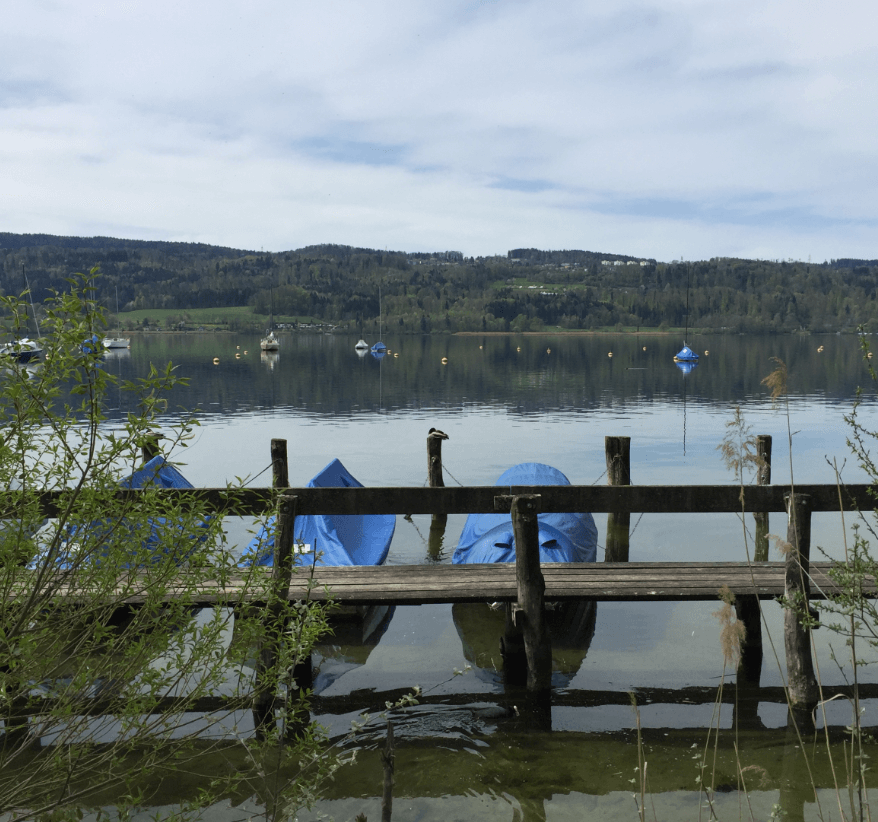 Small boats moored along a quiet lake - Moral Letters to Lucilius