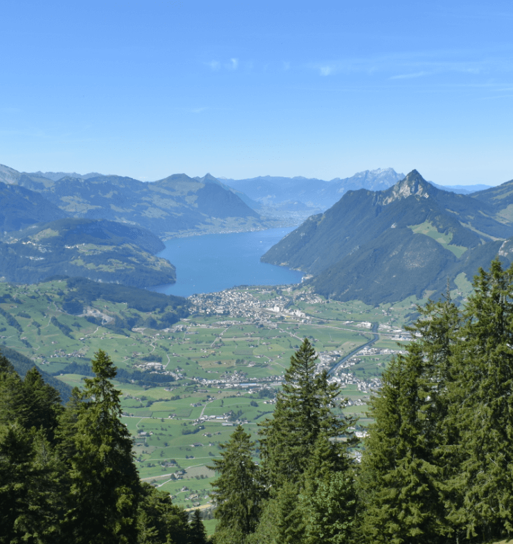 Long view of an alpine plain with a glacial lake and mountains - Moral Letters to Lucilius