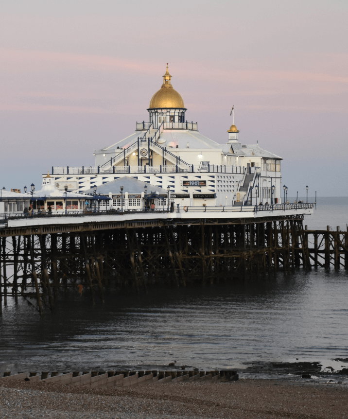 A seaside pier with a gold-domed white pavilion - Moral Letters to Lucilius