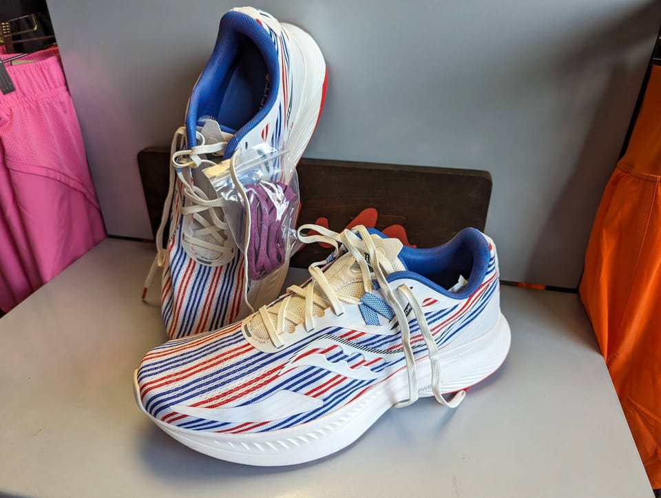 A pair of red, white, and blue running shoes