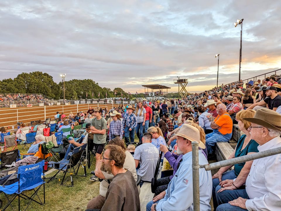 Row upon row of people sitting in crowded bleachers