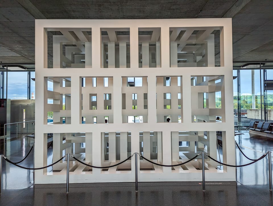 Large sculpture of a white square filled with white squares